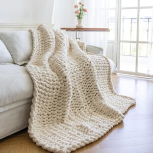 Cream-colored chunky knit throw